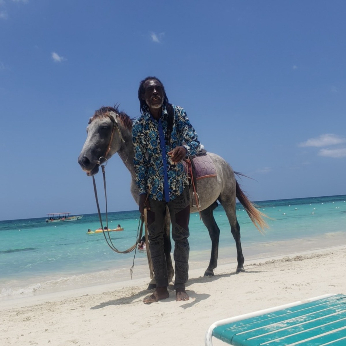 A local horseman and his horse on the beach in Jamaica