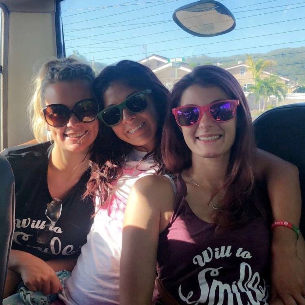 Three members of our team in Will to Smile shirts
